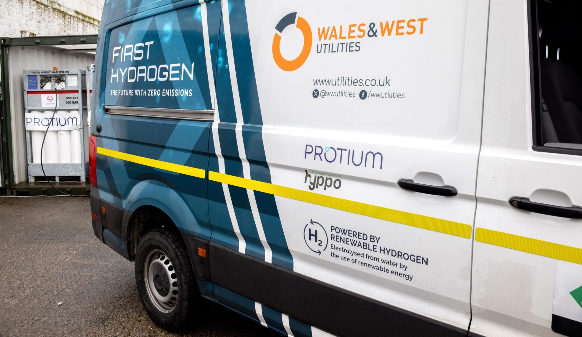 Hydrogen-powered van branded "First Hydrogen" with Wales & West Utilities logo, displaying "Powered by Renewable Hydrogen"...
